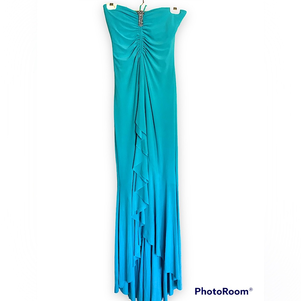 New With Tags! A beautiful formal turquoise blue dress.